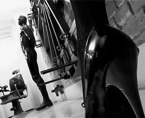 Black-haired fierce domina tantalizes a obedient masculine